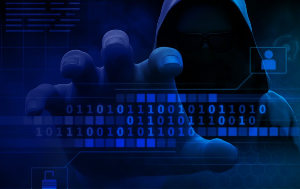 Data breach concept image featuring a hooded hacker accessing digital information, highlighting cybersecurity risks, stolen credentials, and online account security.