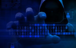 Data breach concept image featuring a hooded hacker accessing digital information, highlighting cybersecurity risks, stolen credentials, and online account security.