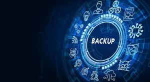 Illustration of business data backup with a digital backup icon surrounded by cloud storage, network, and technology symbols on a blue background.