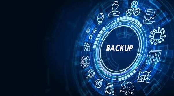 Illustration of business data backup with a digital backup icon surrounded by cloud storage, network, and technology symbols on a blue background.